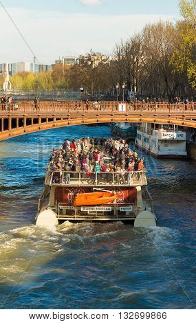 Paris France-April 05 2016: The pleasure boat Jeanne Moreau on Seine river near Notre Dame cathedral Paris France.