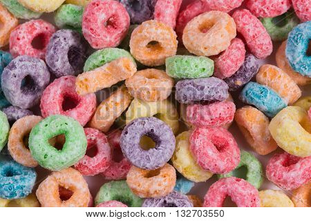 Colorful round cereal background with orange, purple, yellow, green and blue