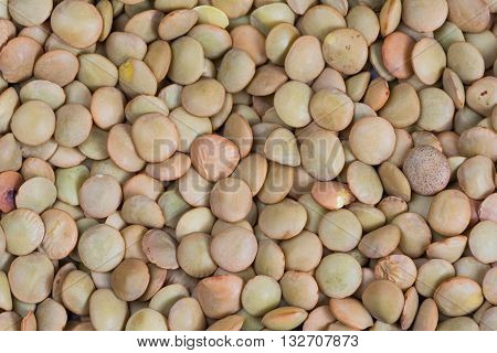 Uncooked peas scattered flat for textured background