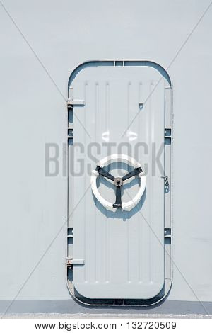 Battle ship and Marine door on gray background