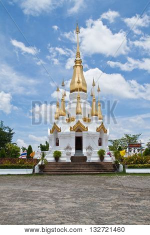 Golden Pagoda and blue sky in Wat Tham Khuha SawanUbonratchathanee Province Thailand.