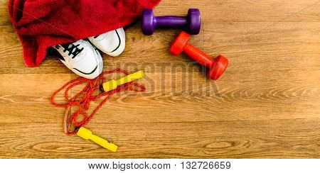 sport equipment, rope, fitness, sports, towel, sneakers, wooden floor, running shoes, sports dumbbells, sport stuff