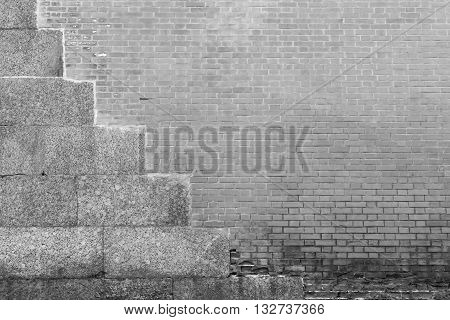 vintage texture of a gray brick wall with cement plates for an ancient background and for old architectural wallpaper