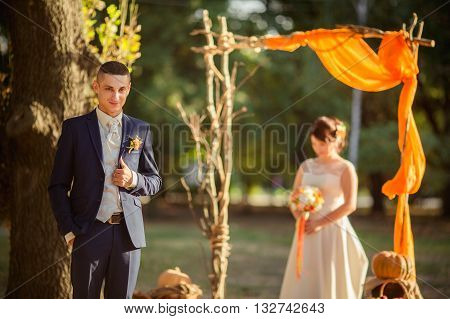 Bride and groom on their wedding fall day