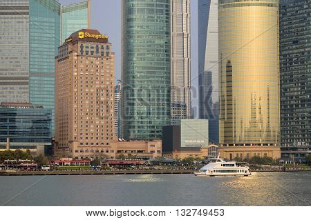 SHANGHAI, CHINA - MARCH 25: Pudong district view from The Bund waterfront area on March 25, 2016 in Shanghai, China. Pudong is a district of Shanghai, located east of the Huangpu River.