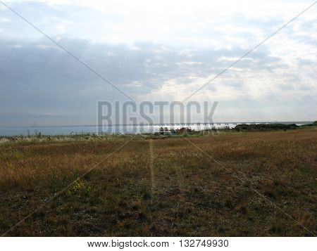 Sea coast of Funen Island in the sun rays