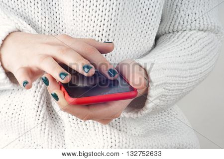 Beautiful young hipster woman using smart phone. Copy space for text.