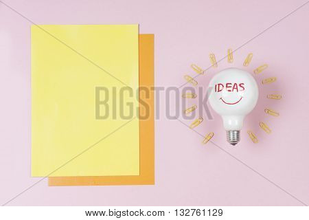 great idea concept with crumpled colorful paper and light bulb on light background. Creative brainstorm concept business idea. female hand holding light bulb. Copy space for text.