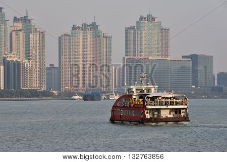 SHANGHAI CHINA - MARCH 25: Pudong district view from The Bund waterfront area on March 25 2016 in Shanghai China. Pudong is a district of Shanghai located east of the Huangpu River.