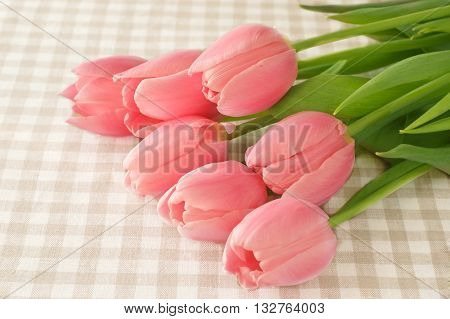 Lovely tulip flowers on table rustic design