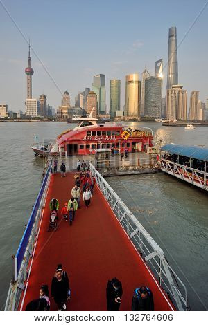 SHANGHAI, CHINA - MARCH 25: Pudong district view from The Bund waterfront area on March 25, 2016 in Shanghai, China. Pudong is a district of Shanghai, located east of the Huangpu River.