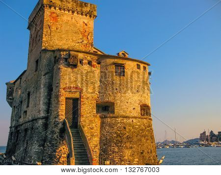 The medieval castle at sunset in Rapallo, famous Italian tourist resort close to Portofino and Santa Margherita Ligure in the province of Genoa, Ligury, Italy.