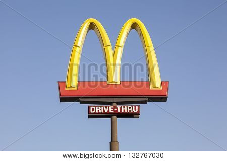 FORT WORTH USA - APR 6: American fast food restaurant chain McDonalds Logo against blue sky. April 6 2016 in Fort Worth Texas USA