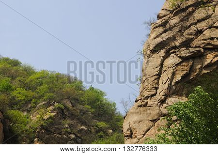 A rocky outcropping within the Heilong Pond area of the Lakeside Great wall scenic area in Beijing China.
