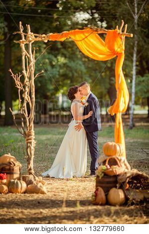 Bride and groom on their wedding fall day