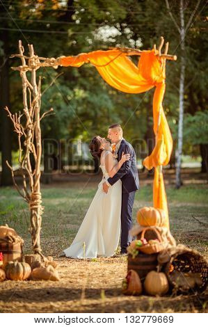 Bride and groom on their wedding fall day