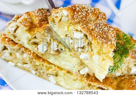 Achma - khachapuri with cheese and dill. Traditional georgian cuisine. Selective focus