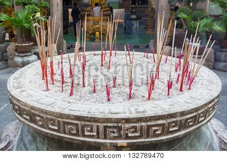 BANGKOK THAILAND -7 MAY 2016 : Incense burner and Golden buddha statue in Wat Kalayanamitr Bangkok, Thailand