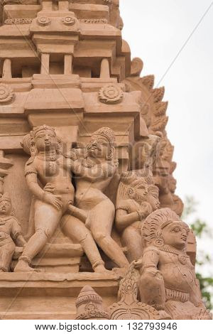 Chettinad India - October 16 2013: Detail of Shiva temple gopuram in Thirumayam. Man copulates with woman in standing position.