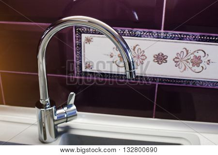 Kitchen Mixer Tap Into Granite Work Surface Background Violet Tile With Ornament