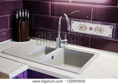 Kitchen Mixer Tap Into Granite Work Surface Background Violet Tile And Knifes
