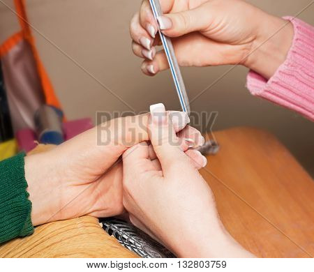 build artificial nails manicure nail painting coating or shellac gel polish correction of artificial nails beauty industry and nail care beauty salons nail aesthetics