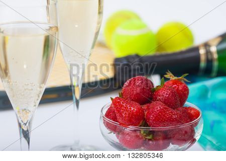 Strawberries and glasses with champagne during Wimbledon tournament