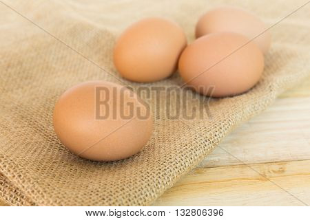 Eggs with heap on wood table background