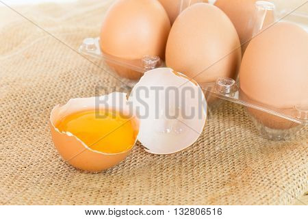 Eggs with heap on wood table background