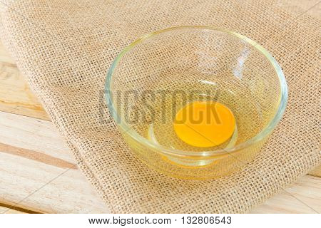 Eggs with heap on wood table background