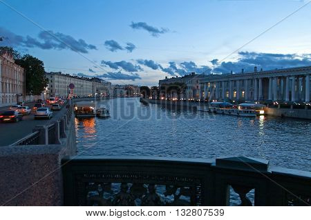 View from Anichkov Bridge in Saint-Petersburg, Russia. The Anichkov Bridge is the oldest and most famous bridge across the Fontanka River in Saint Petersburg Russia. The current bridge built in 1841-42 and reconstructed in 1906-08