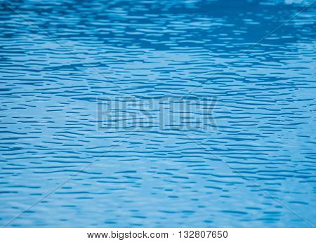 Blue water in the pool. Background of sea and ocean.
