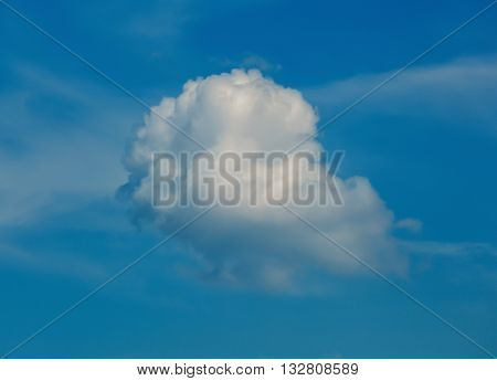 Big fluffy cloud in the blue sky.