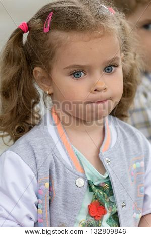 TIMISOARA ROMANIA - JUNE 1 2016: Portrait and expression of one little girl that expected place at one workshop with face painting for children. International children day.