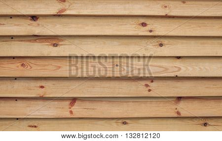 Fence of downed pine boards close-up. Background. Wood texture.
