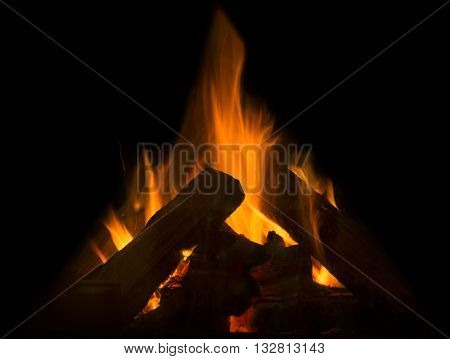 Flame of fire in the fireplace on a black background