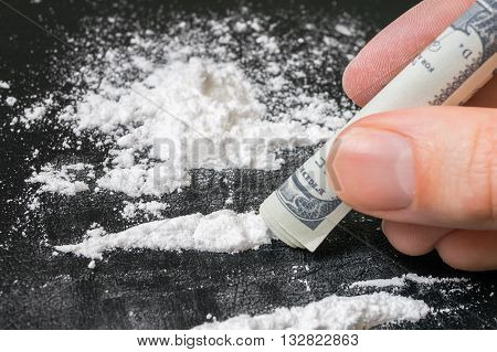 Junkie Is Snorting Cocaine White Powder With Rolled Banknote. Na