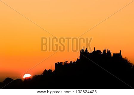 Castle silhouette at sundown. Italian panorama from "Marostica". Orange sky