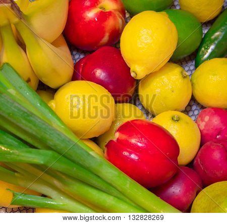 Summer fruits and veggies - lemons, limes, banana...