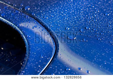 Car detailing series : Droplets on blue car bonnet