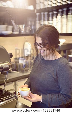 Female Barista Or Waitress Making Cappuccino
