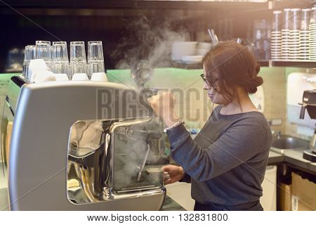 Female Barista Or Waitress Making Cappuccino
