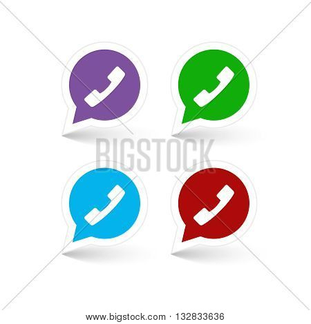 Set of green, red, blue and lilac phone handset in speech bubble icon.