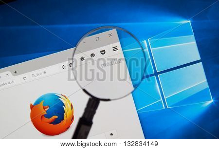 MONTREAL CANADA - JUNE 4 2016 : Firefox web browser under magnifying glass. Firefox is a free and open-source web browser developed by the Mozilla Foundation.