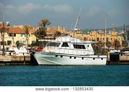 PUERTO SOTOGRANDE, SPAIN - JULY 18, 2008 - Yachts and boats in the marina with buildings to the rear Puerto Sotogrande Cadiz Province Andalucia Spain Western Europe, July 18, 2008.
