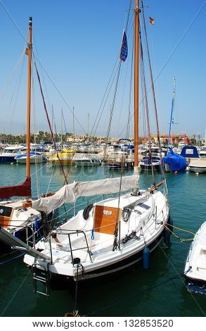 PUERTO SOTOGRANDE, SPAIN - JULY 18, 2008 - Yachts and boats in the marina with buildings to the rear Puerto Sotogrande Cadiz Province Andalucia Spain Western Europe, July 18, 2008.