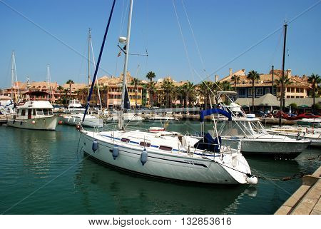 PUERTO SOTOGRANDE, SPAIN - JULY 18, 2008 - Yachts and boats in the marina with buildings to the rear Puerto Sotogrande Cadiz Province Andalucia Spain Western Europe, July 18, 2008.