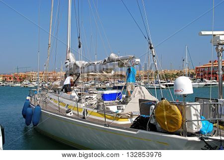 PUERTO SOTOGRANDE, SPAIN - JULY 18, 2008 - Yachts and boats in the marina with buildings to the rear Puerto Sotogrande Cadiz Province Andalucia Spain Western Europe, July 18, 2008.