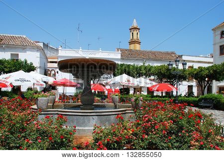 ESTEPONA, SPAIN - JULY 18, 2008 - Fountain and pavement cafes in the Plaza las flores Estepona Malaga Province Andalucia Spain Western Europe, July 18, 2008.
