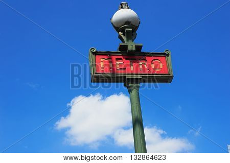 sign of Paris metro on blue sky